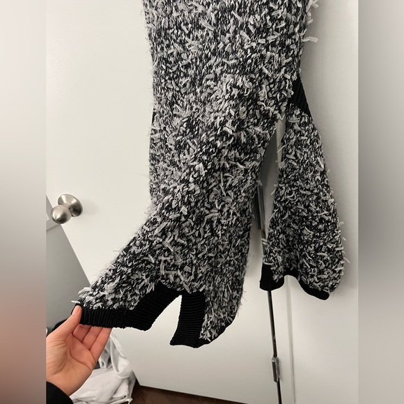 Black cold shoulder sweater with white feather fun material. Long and stretchy. - Picture 3 of 3